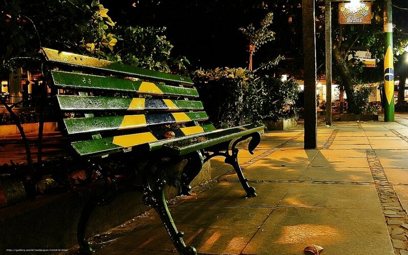 Green Bench on Sidewalk
