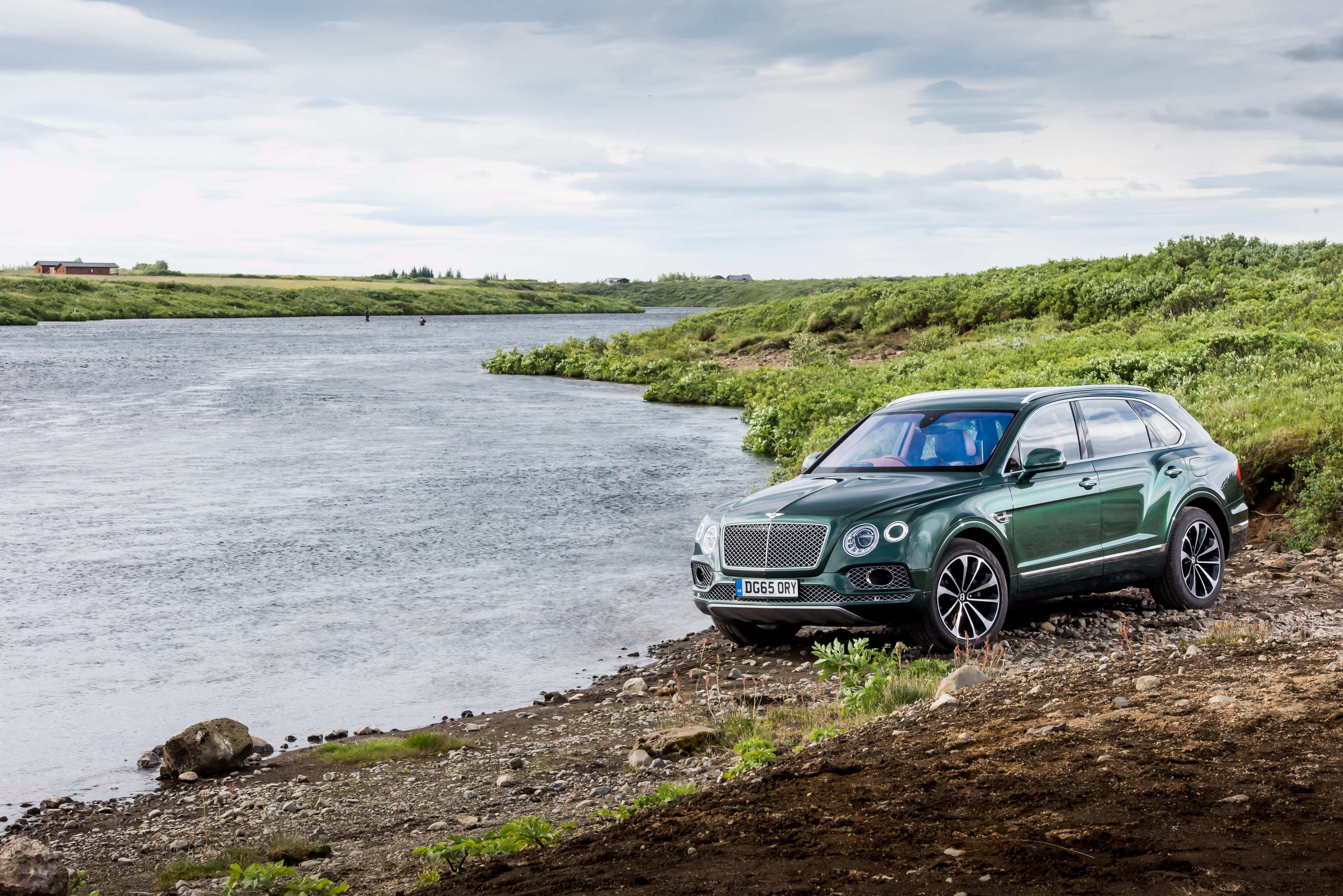 Green Bentley by a river