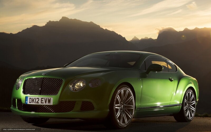 Green Bentley in mountain setting