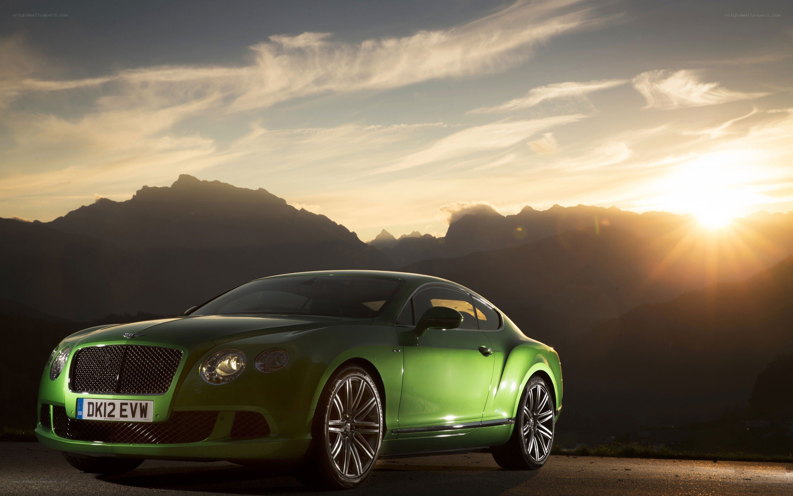 Green Bentley in mountain sunset