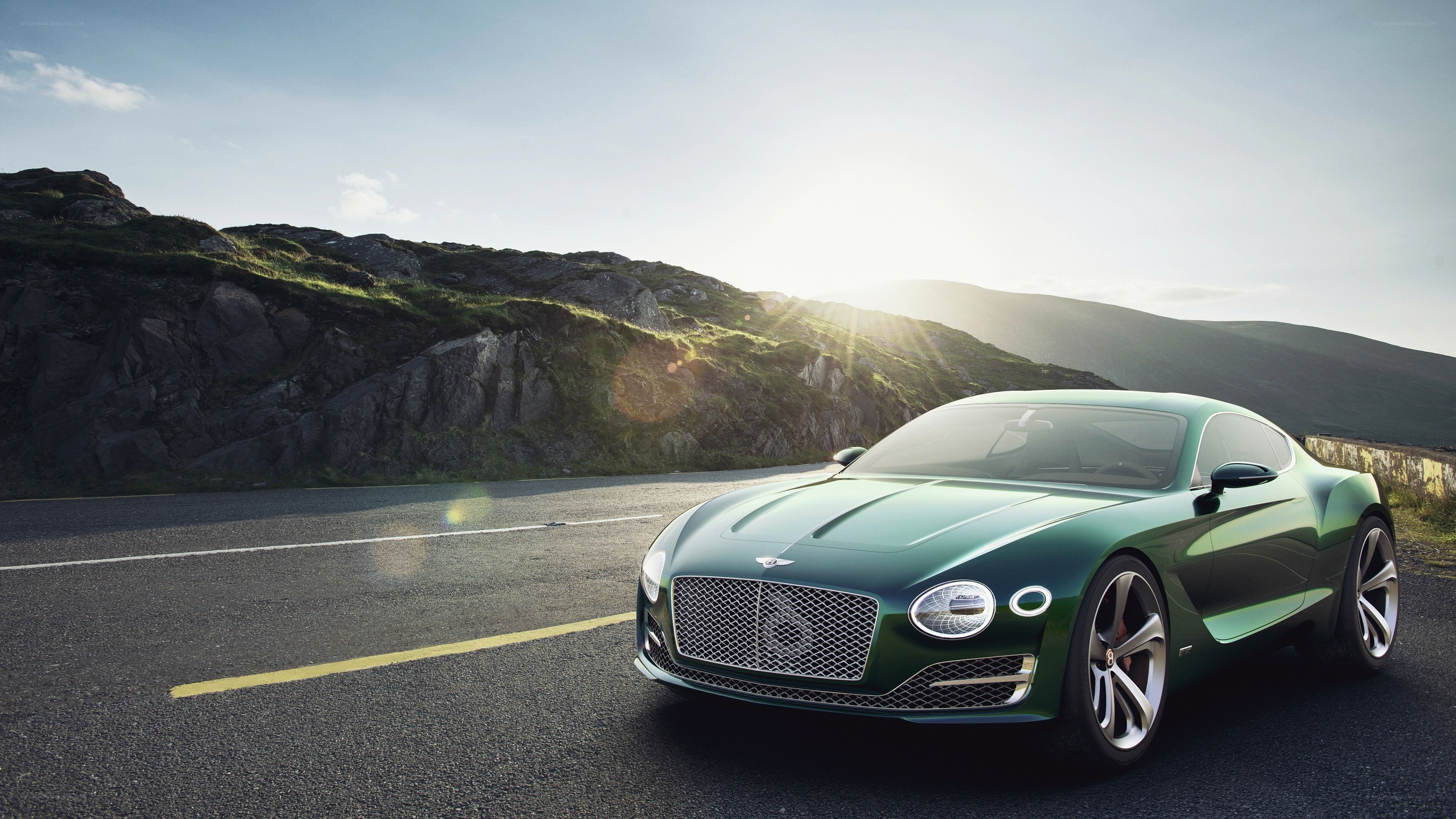 Green Bentley on a mountain road