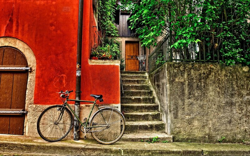 Green Bicycle Against Wall