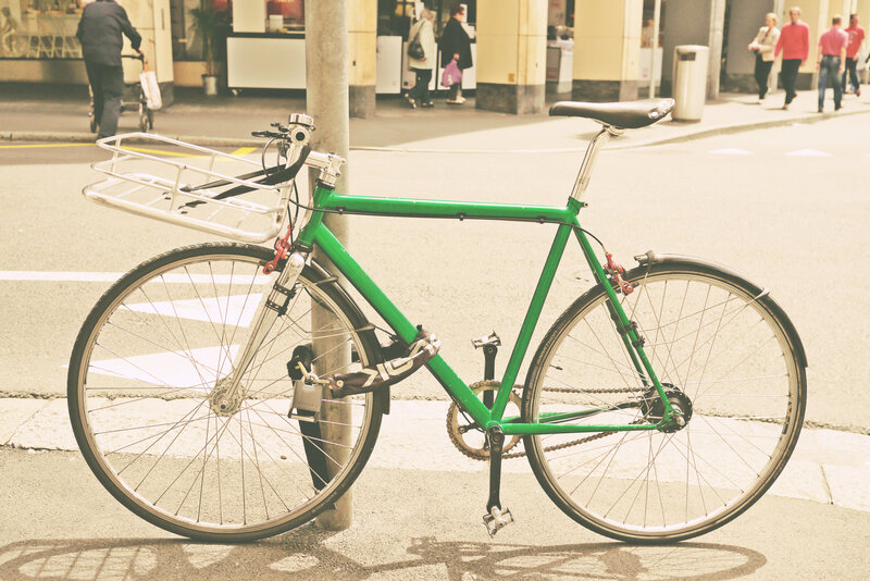 green bike parked on street