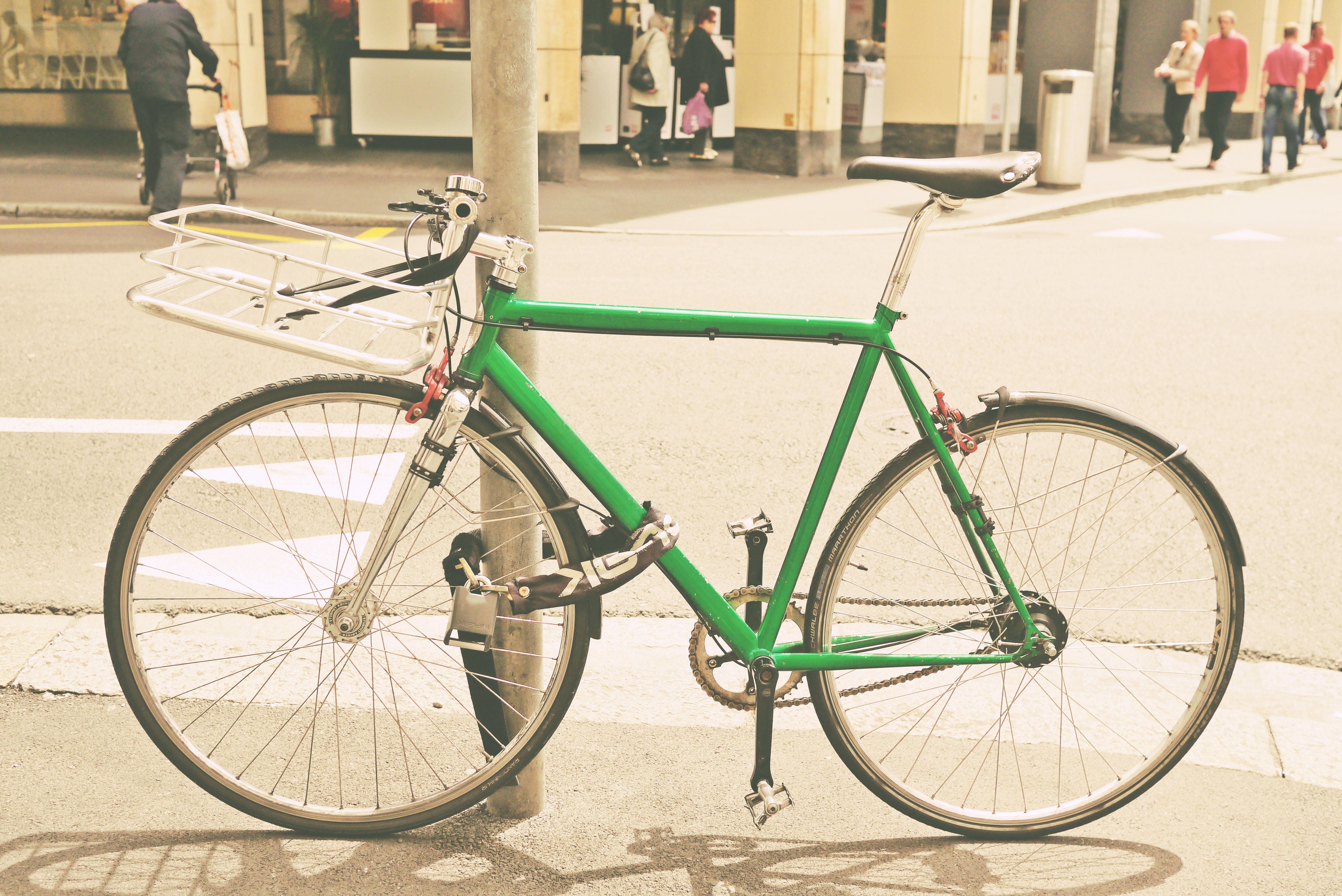 green bike parked on street