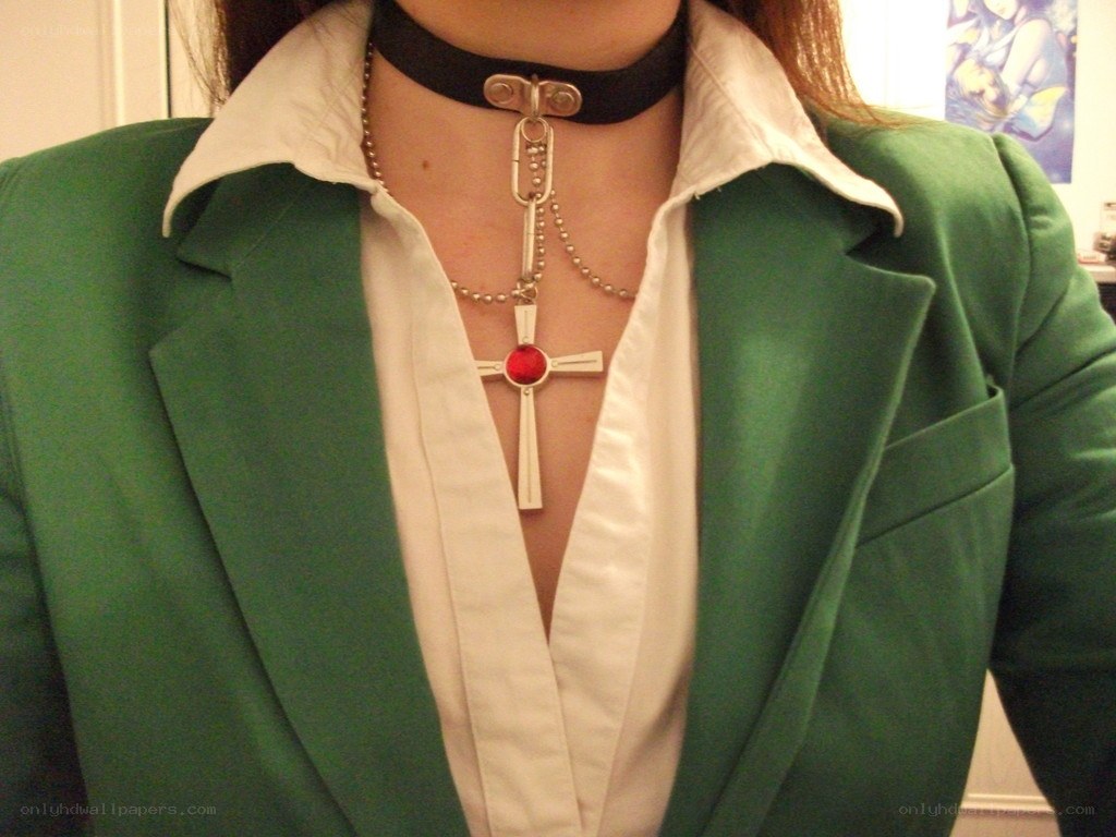 green blazer with cross necklace