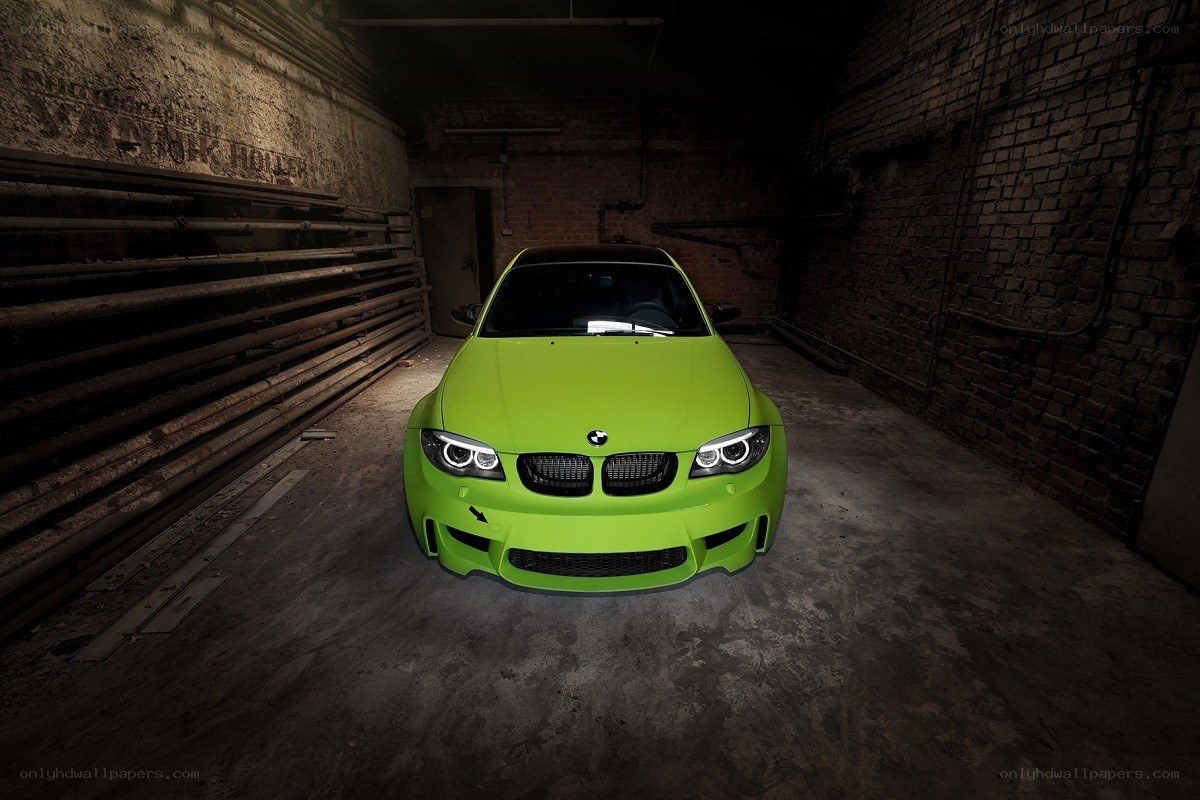 green bmw in a warehouse
