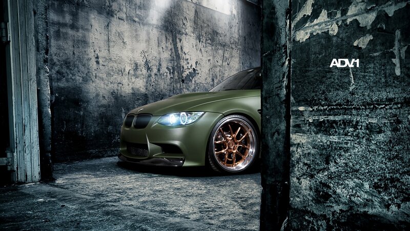 green bmw in dark garage