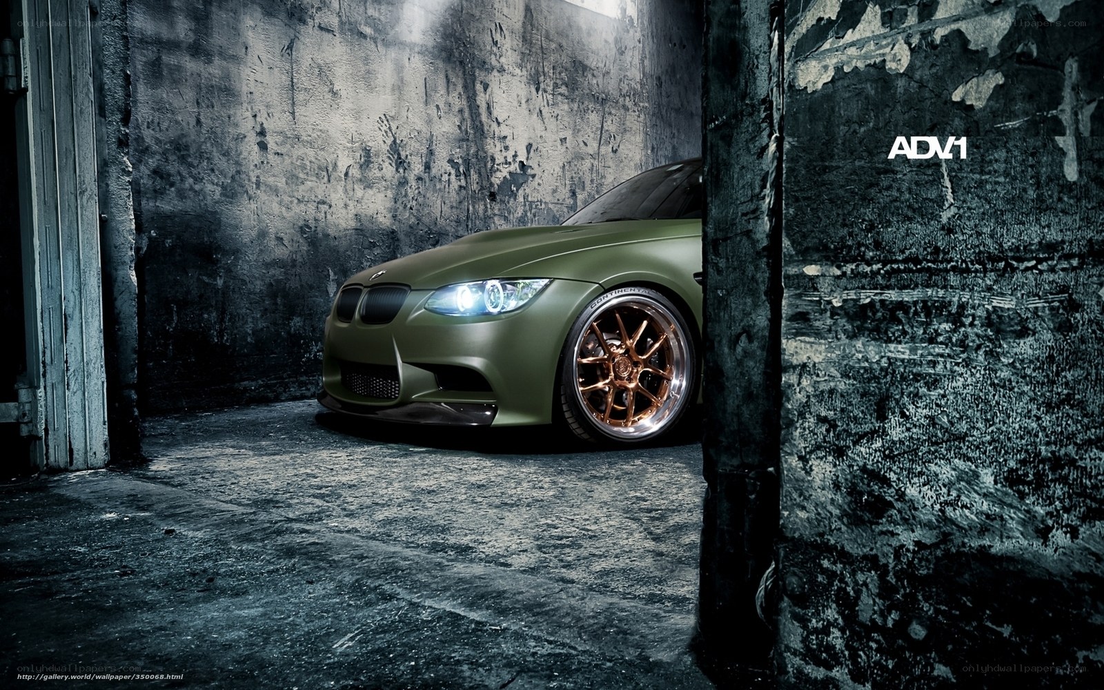 green bmw in industrial setting