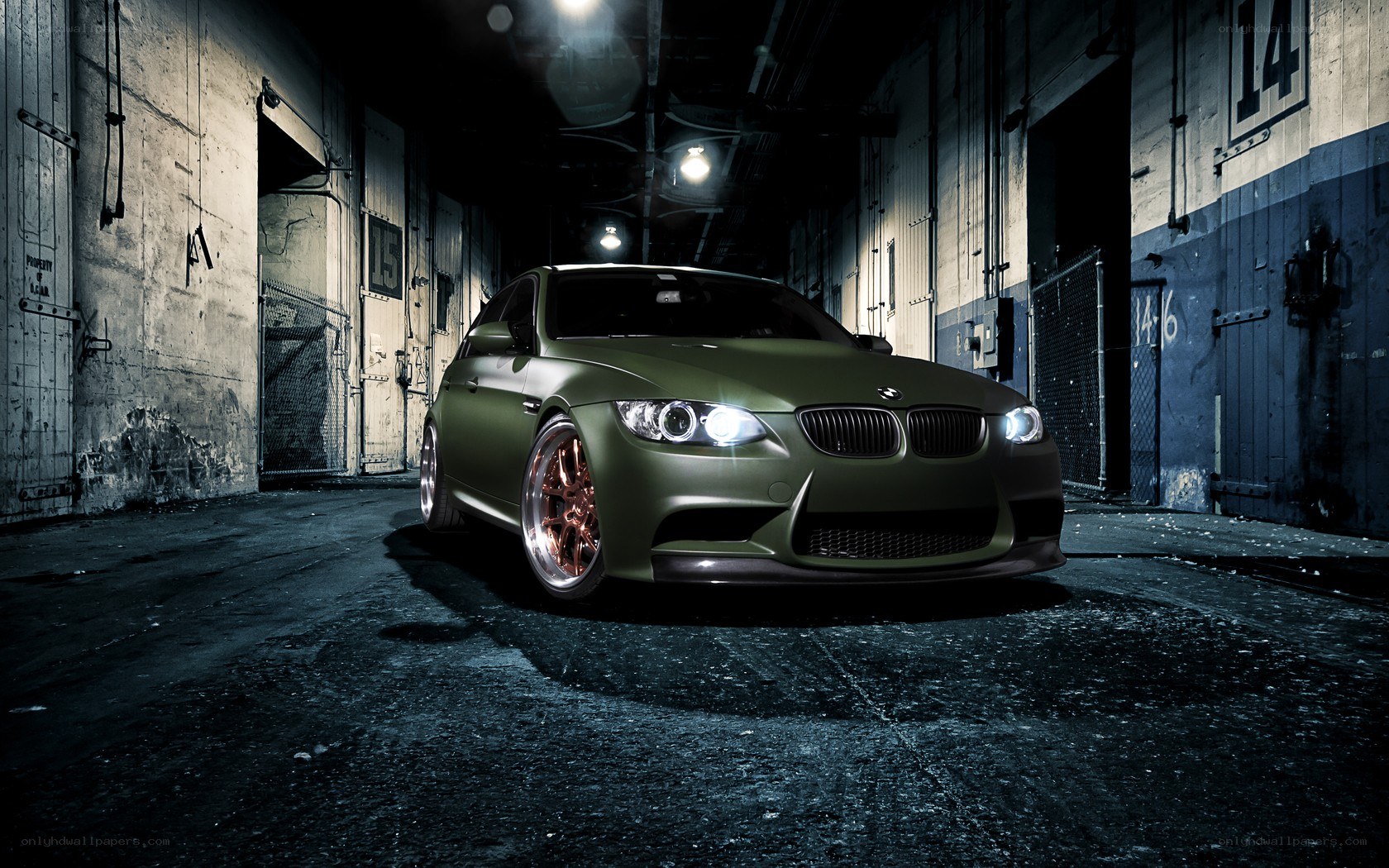 green bmw in warehouse