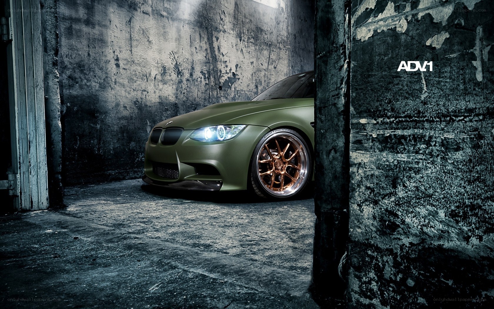 green bmw in warehouse