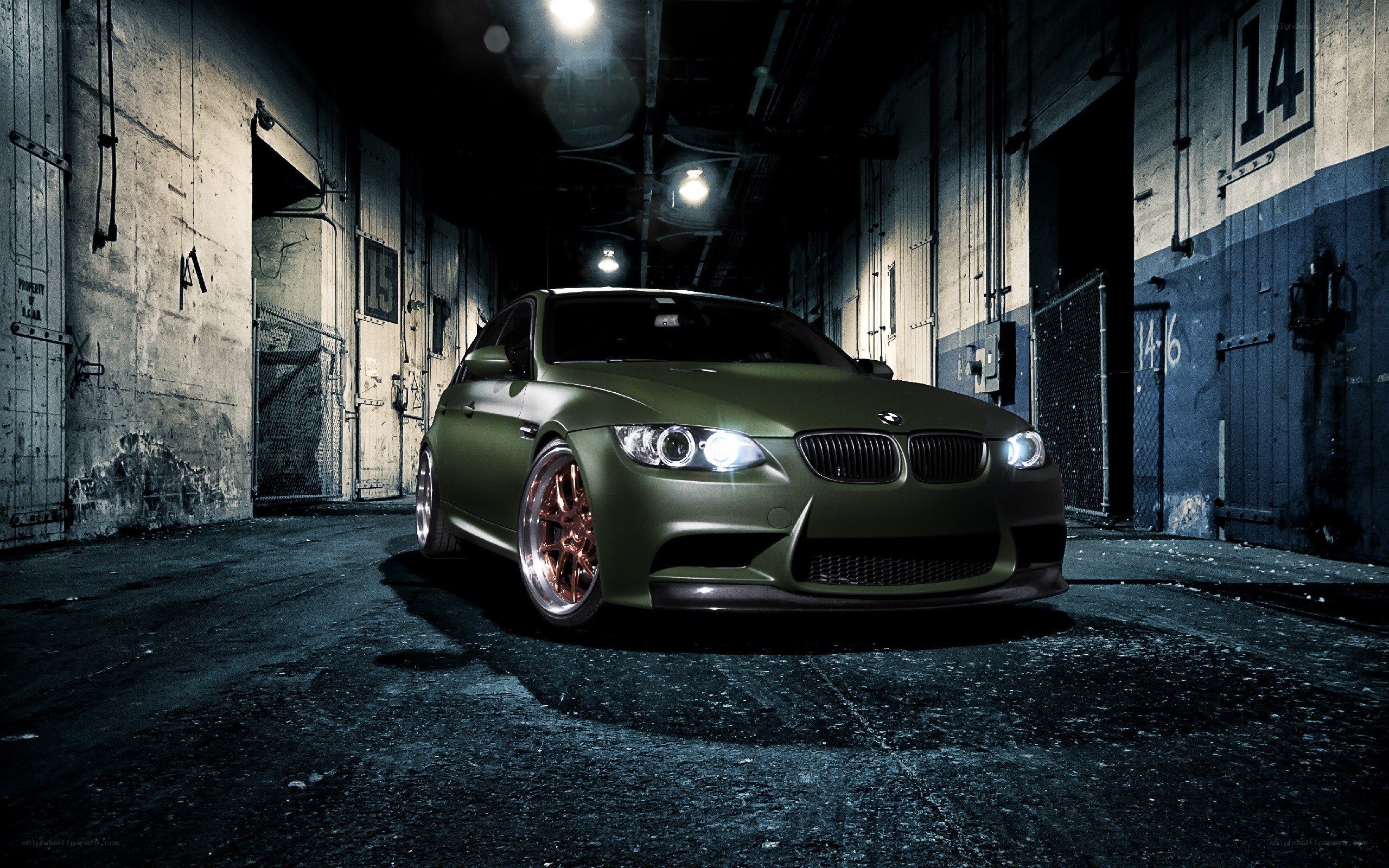 green bmw in warehouse