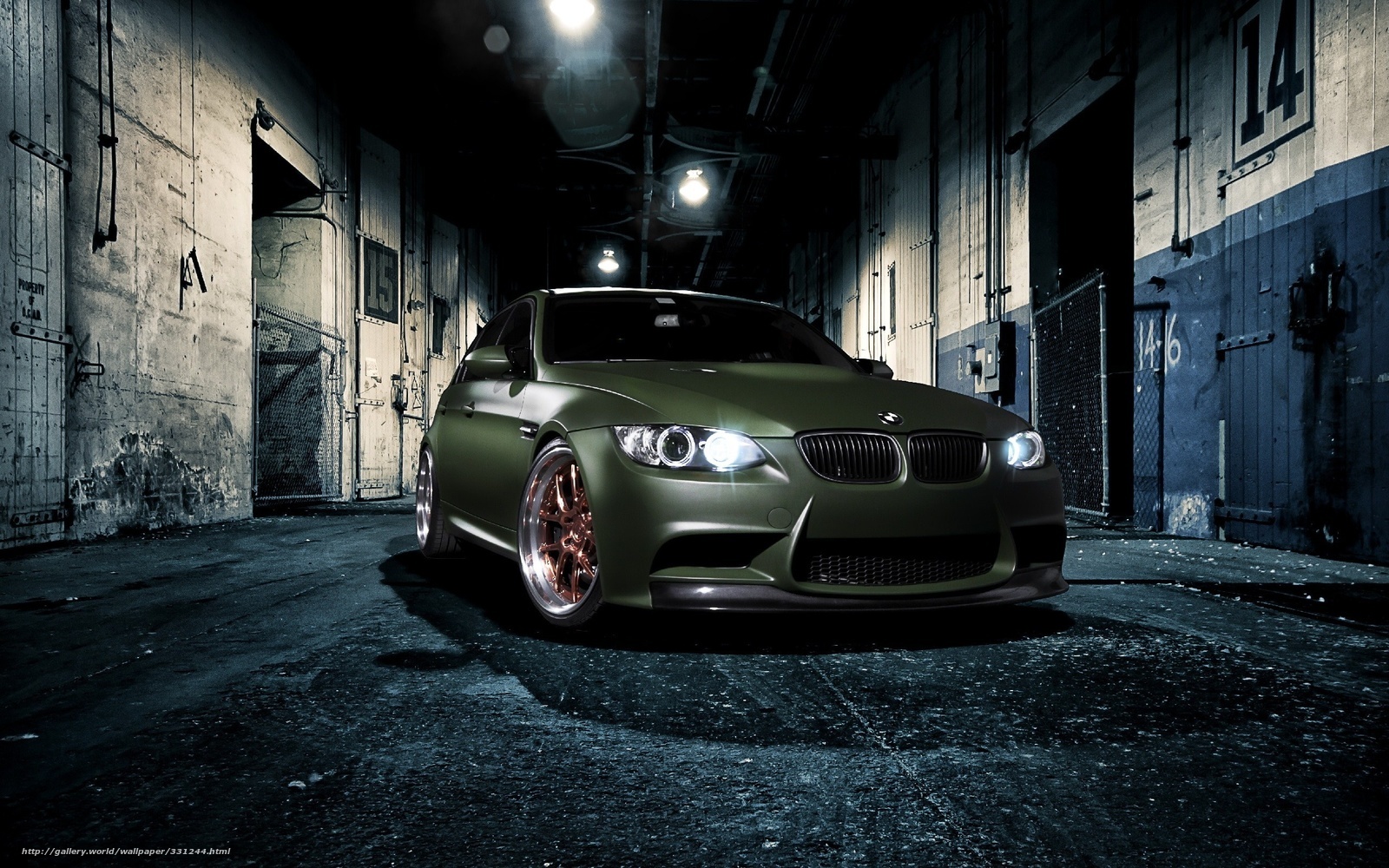 green bmw in warehouse