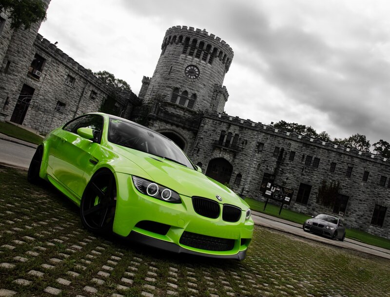 green bmw m3 in front of castle