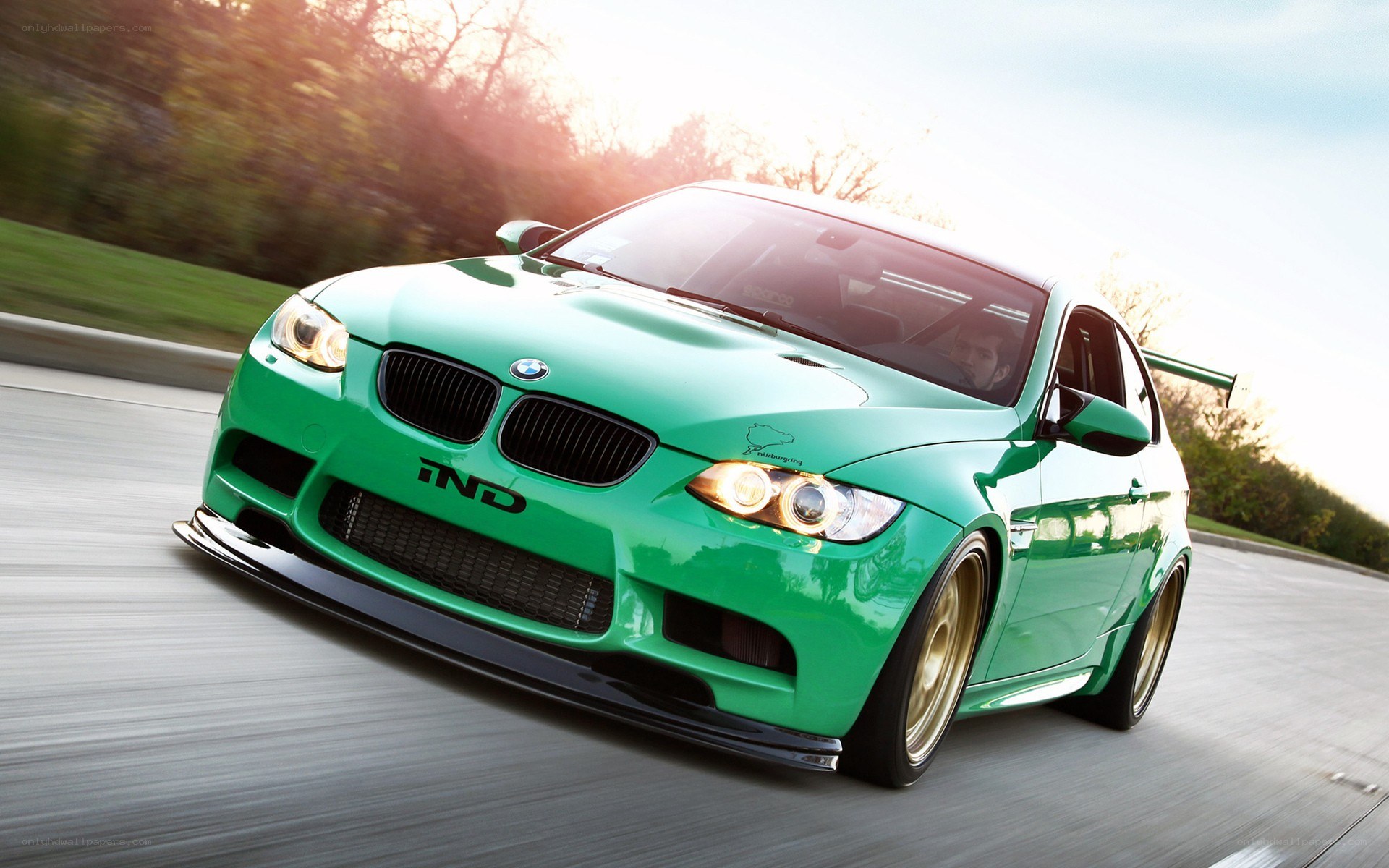 green bmw m3 in motion