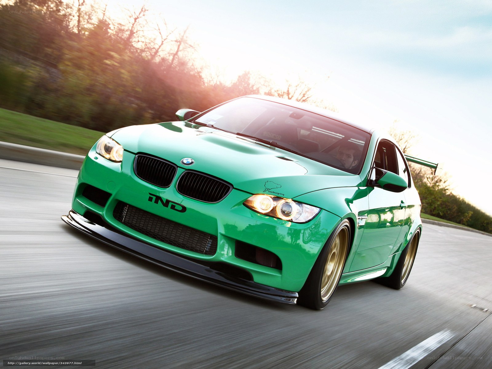 green bmw m3 in motion