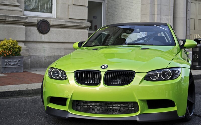 green bmw m3 on city street