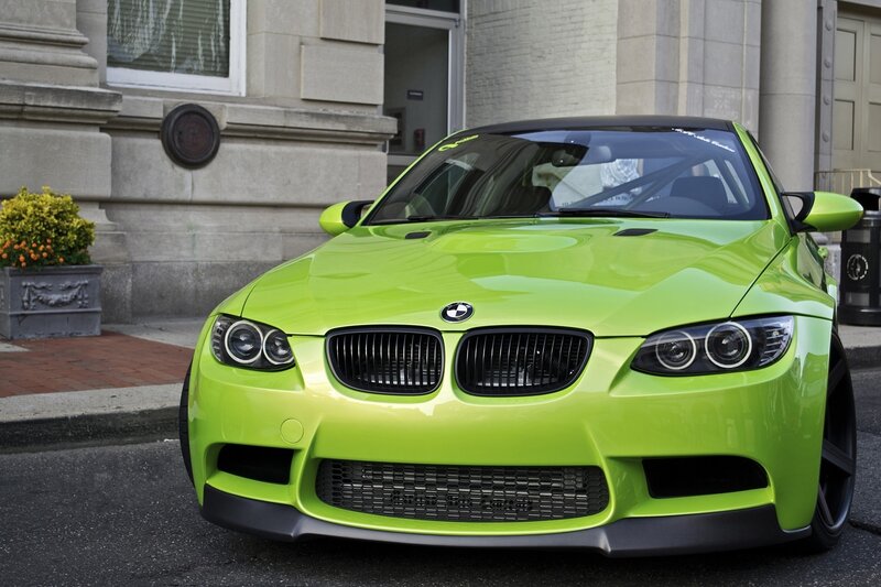 green bmw m3 on city street
