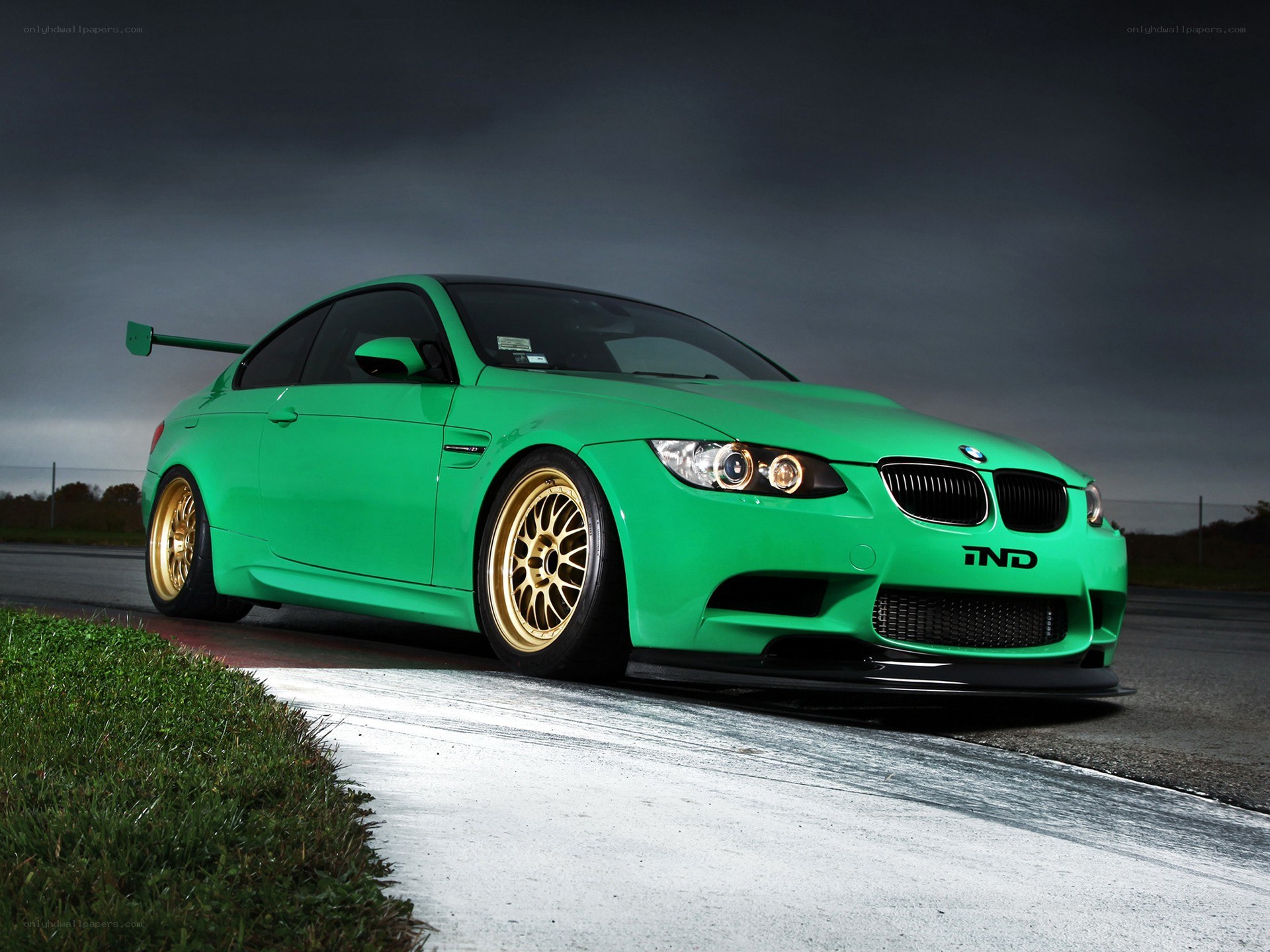 green bmw m3 on racetrack