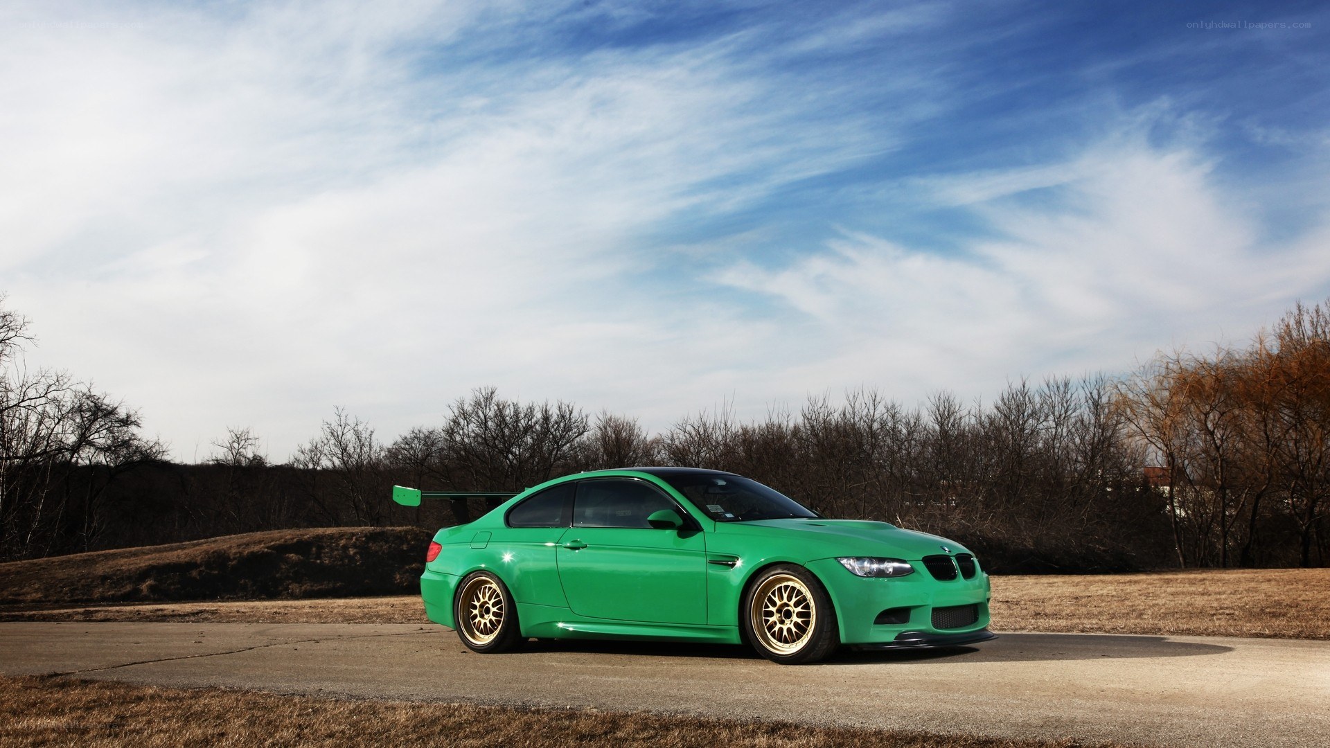green bmw m3 on road