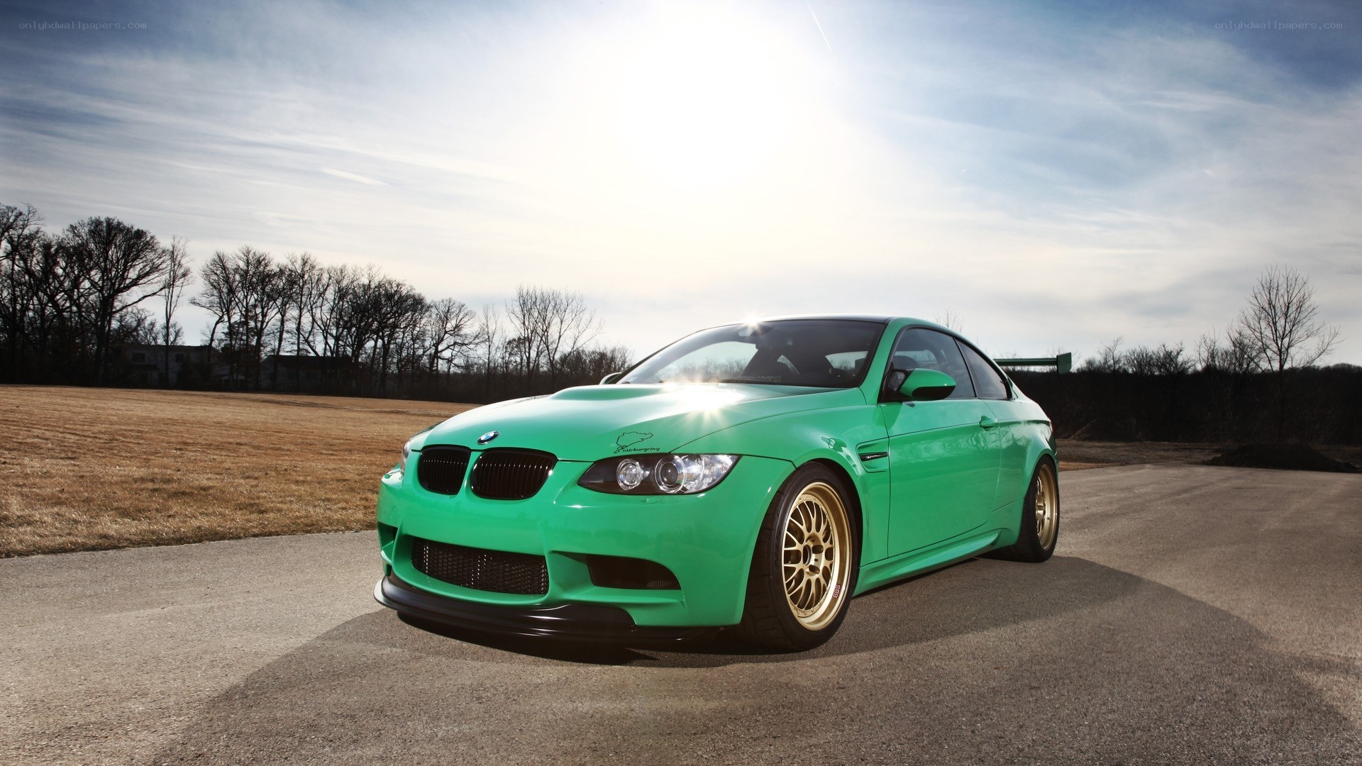 green bmw m3 on road