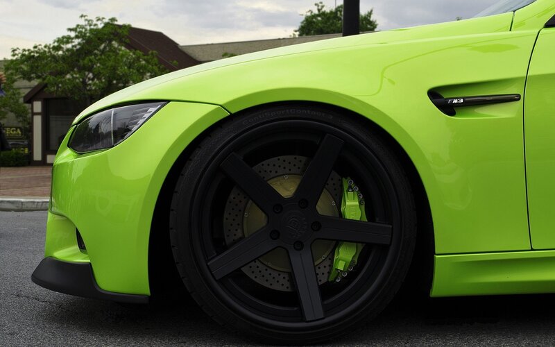 green bmw m3 with black wheels