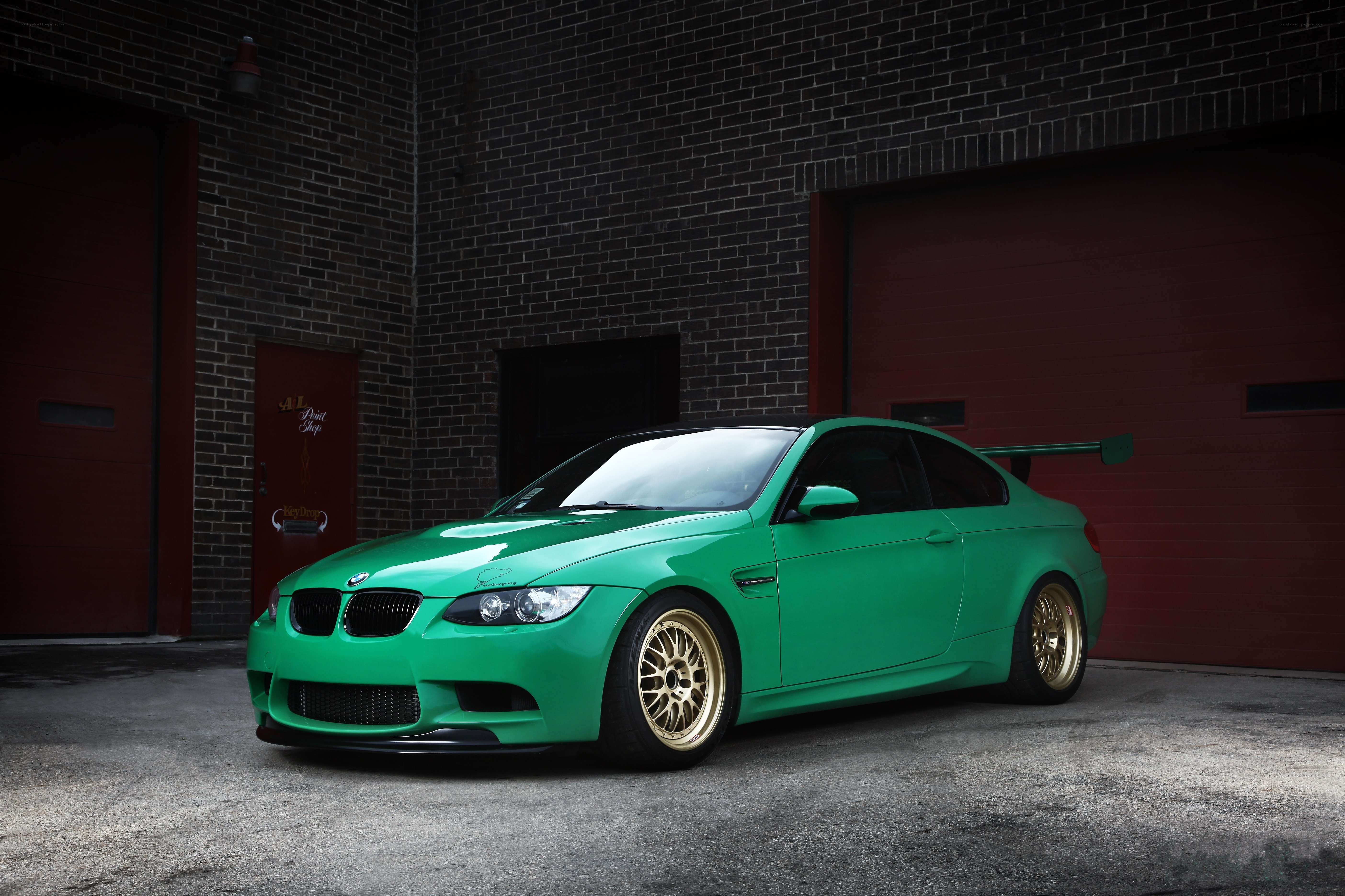 green bmw m3 with gold wheels