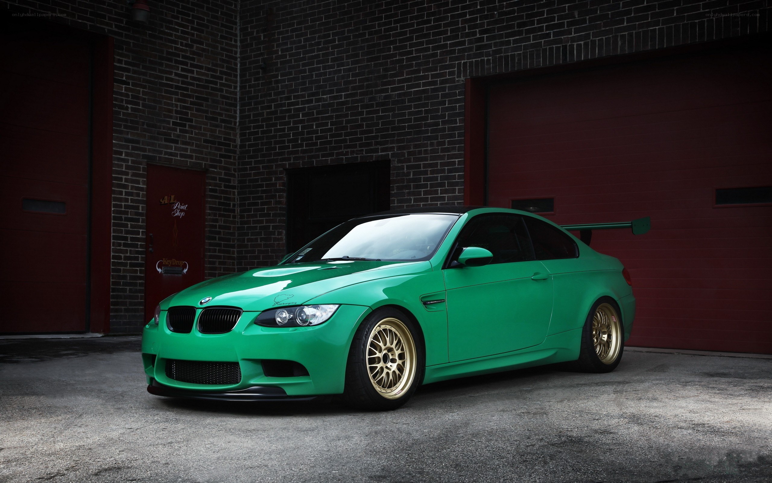 green bmw m3 with gold wheels