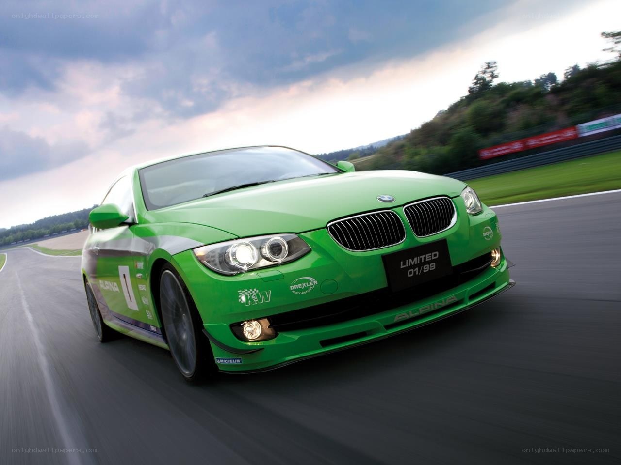 Green BMW on a racetrack