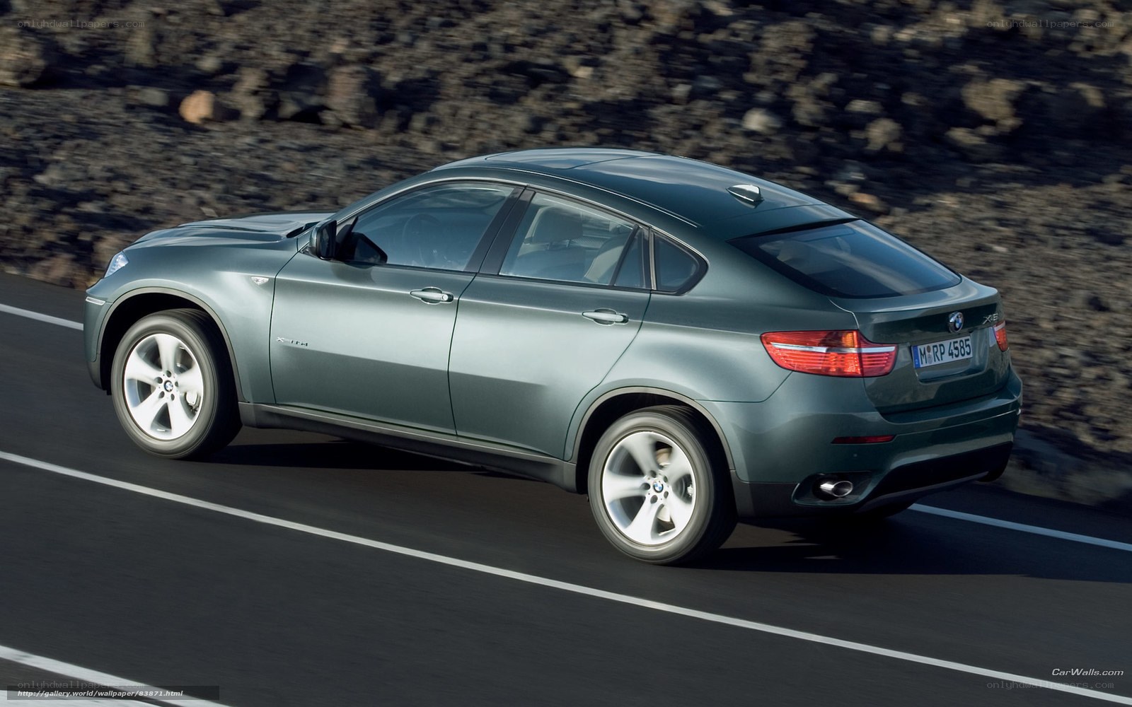 green bmw x6 in motion