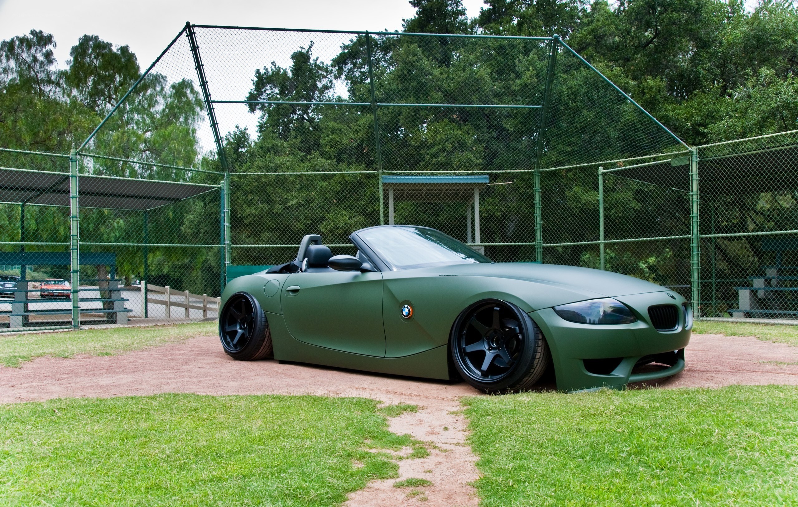 Green BMW Z4 in a baseball field