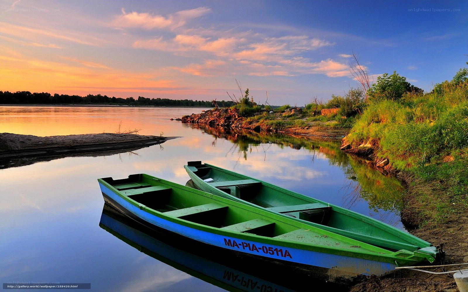 Green boats at sunset