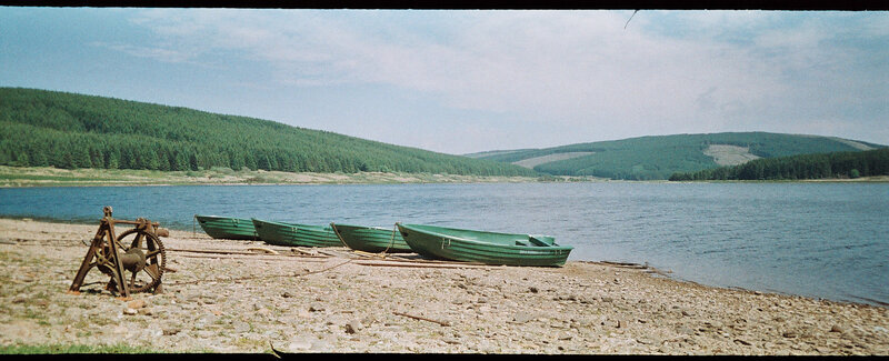 Green Boats on Shore