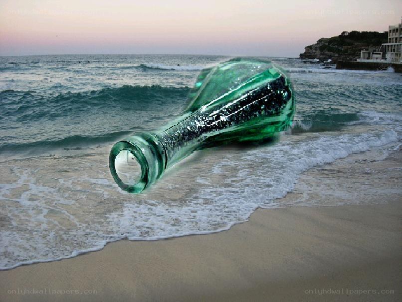 green bottle on beach