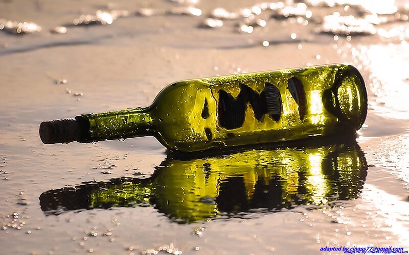 Green Bottle on Wet Sand