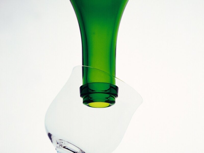 green bottle pouring into glass