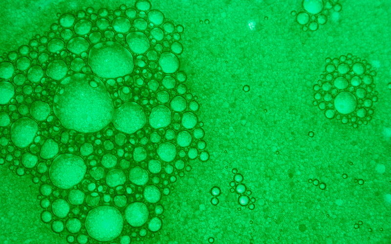 green bubbles in liquid