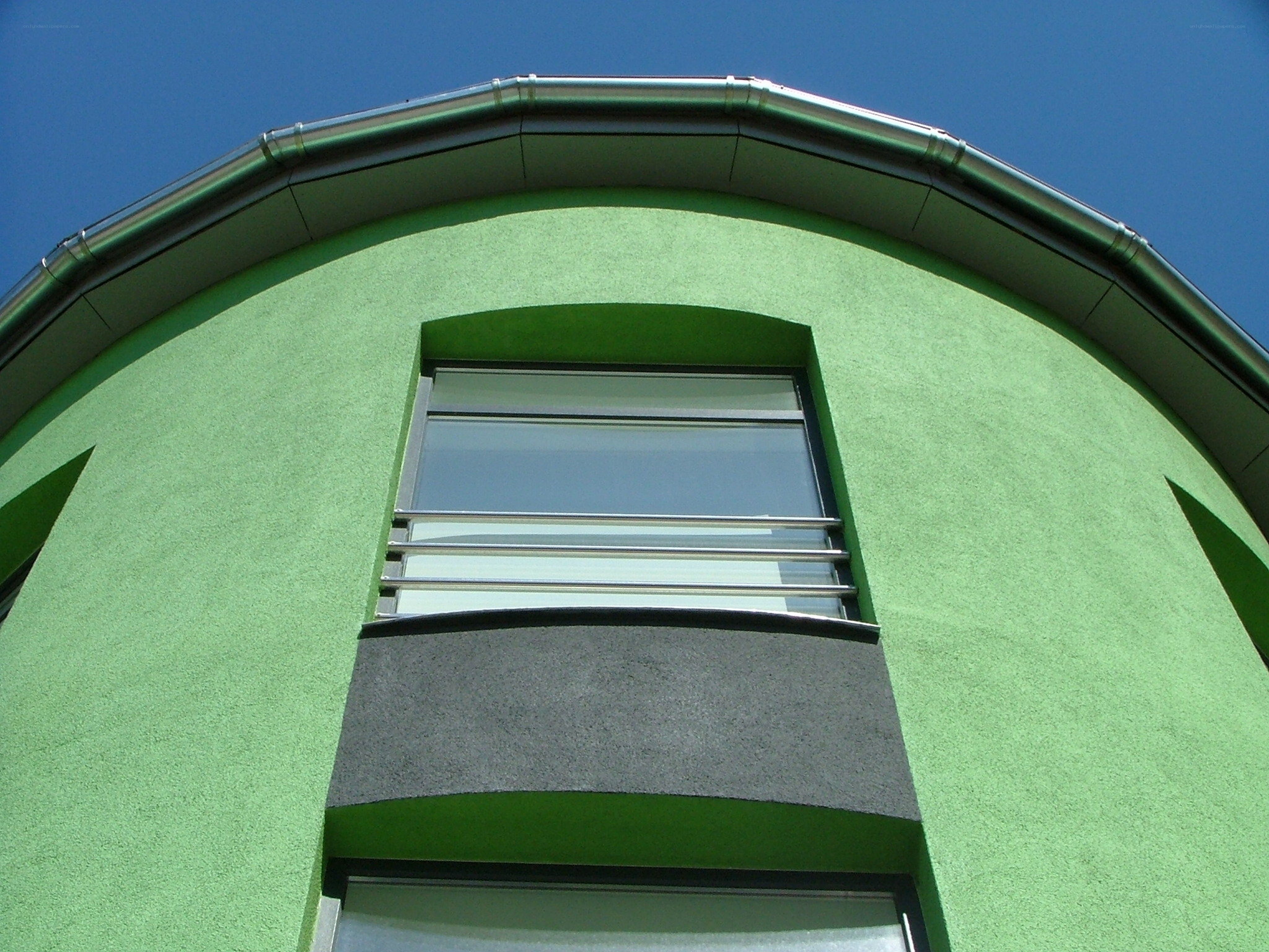 green building with arched window