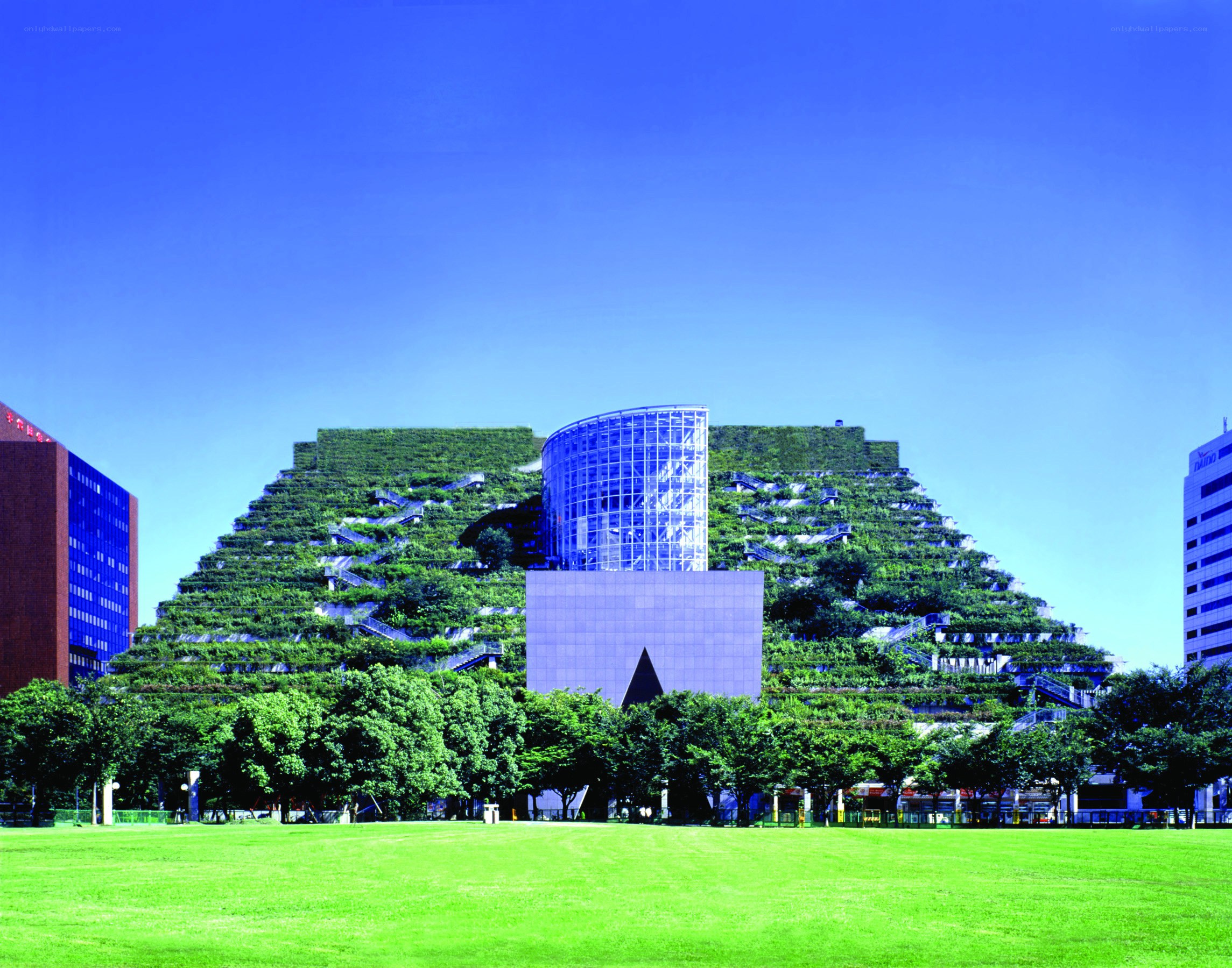 green building with glass tower