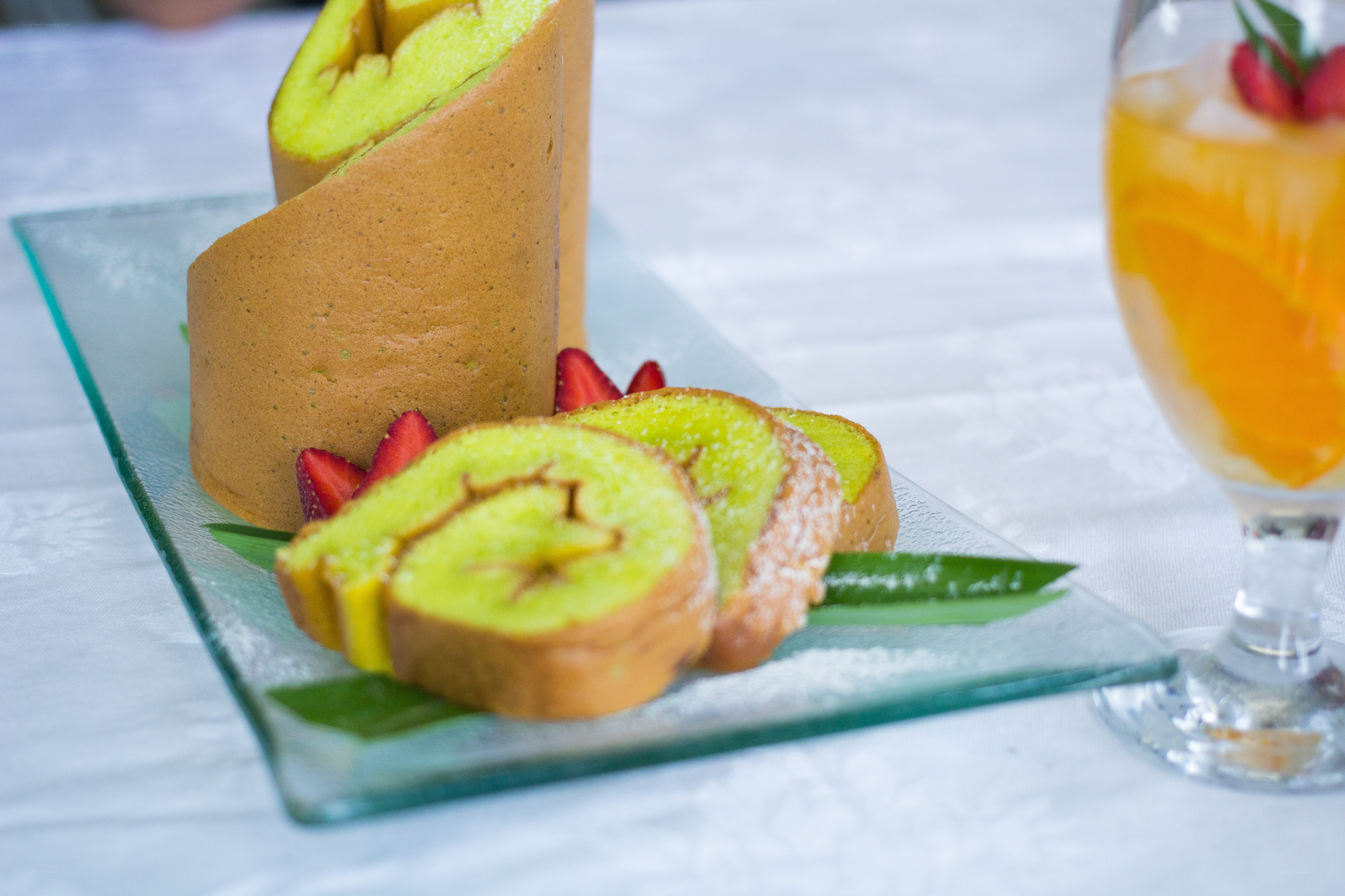 Green cake roll with strawberries