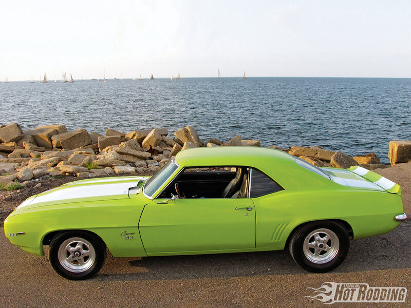 Green Camaro by the water