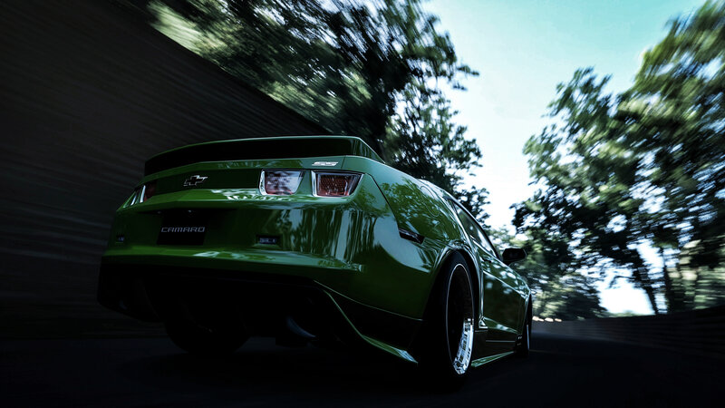 green camaro in motion