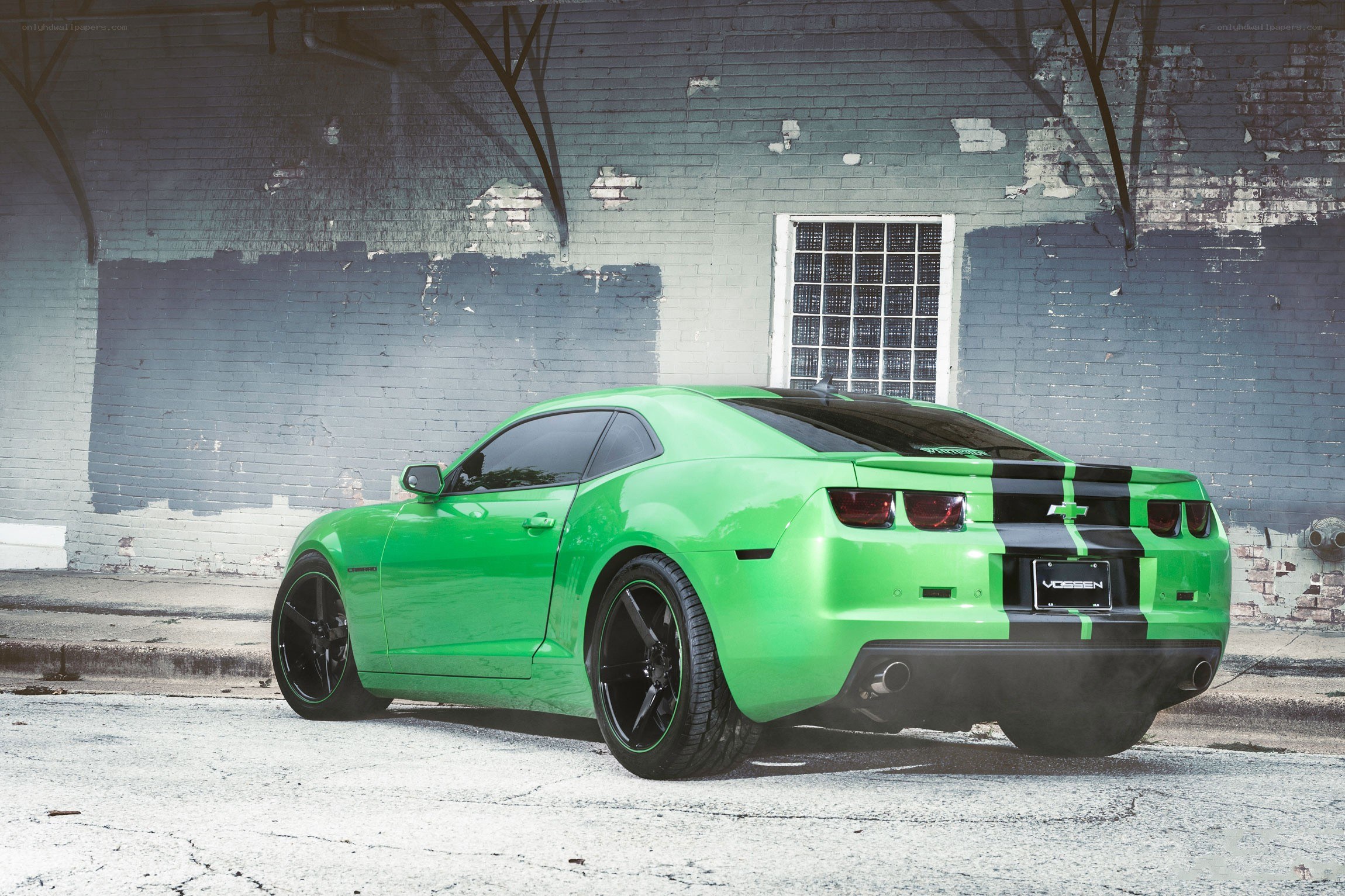 green camaro in urban setting