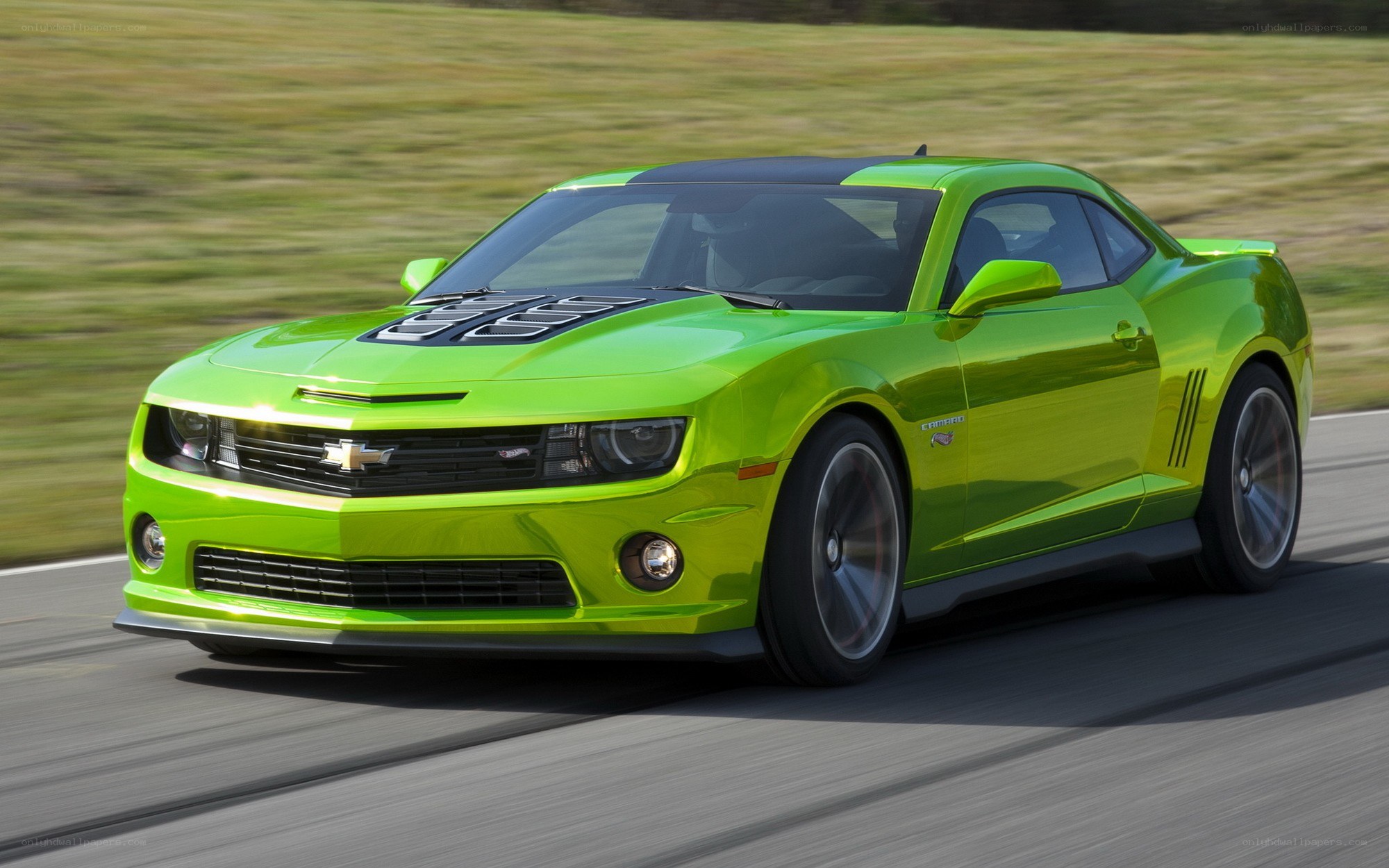 green camaro on a road