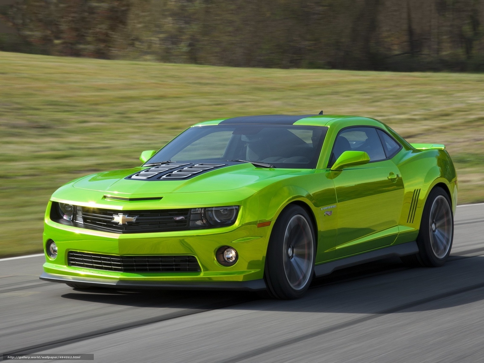 green camaro on road