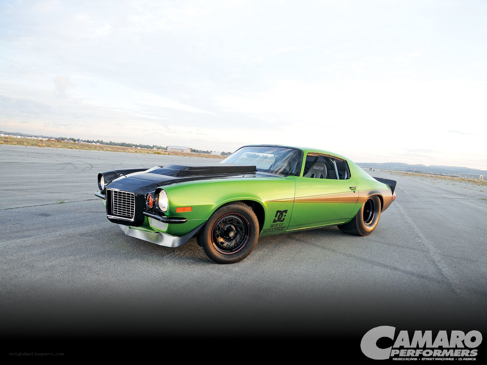 green camaro on tarmac
