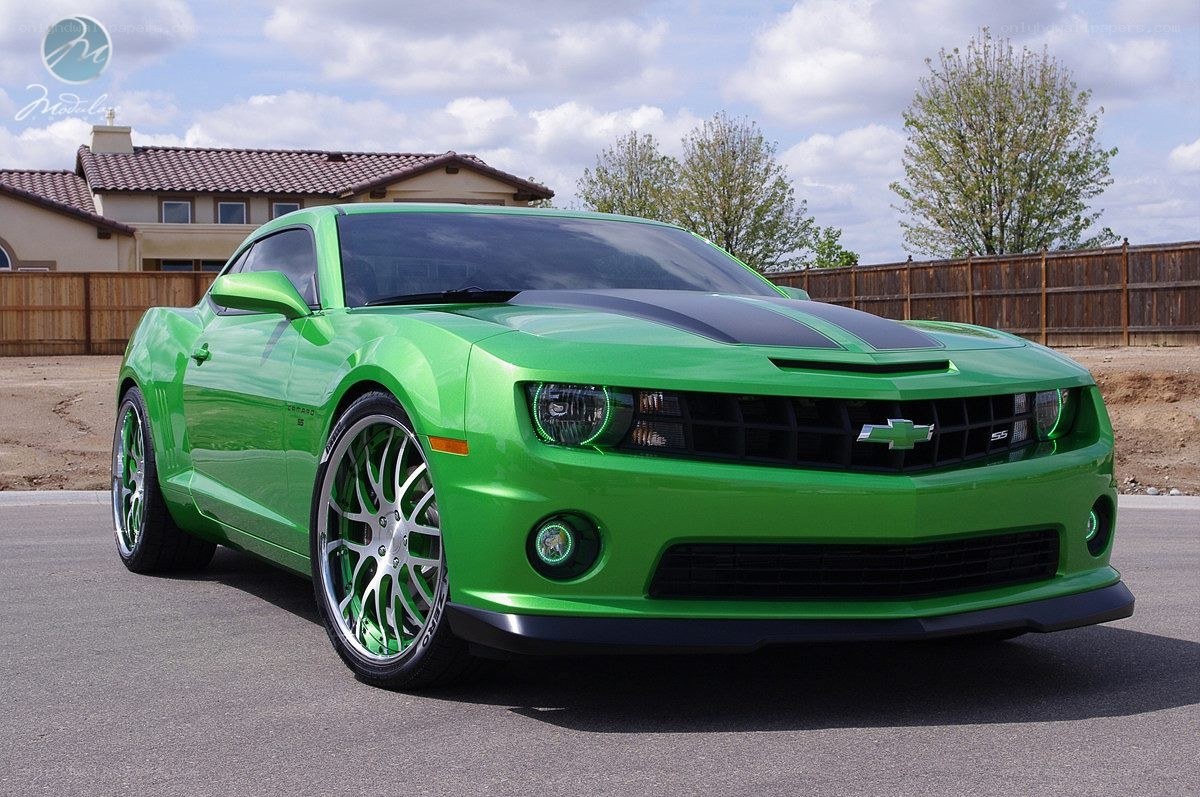 green camaro with custom wheels