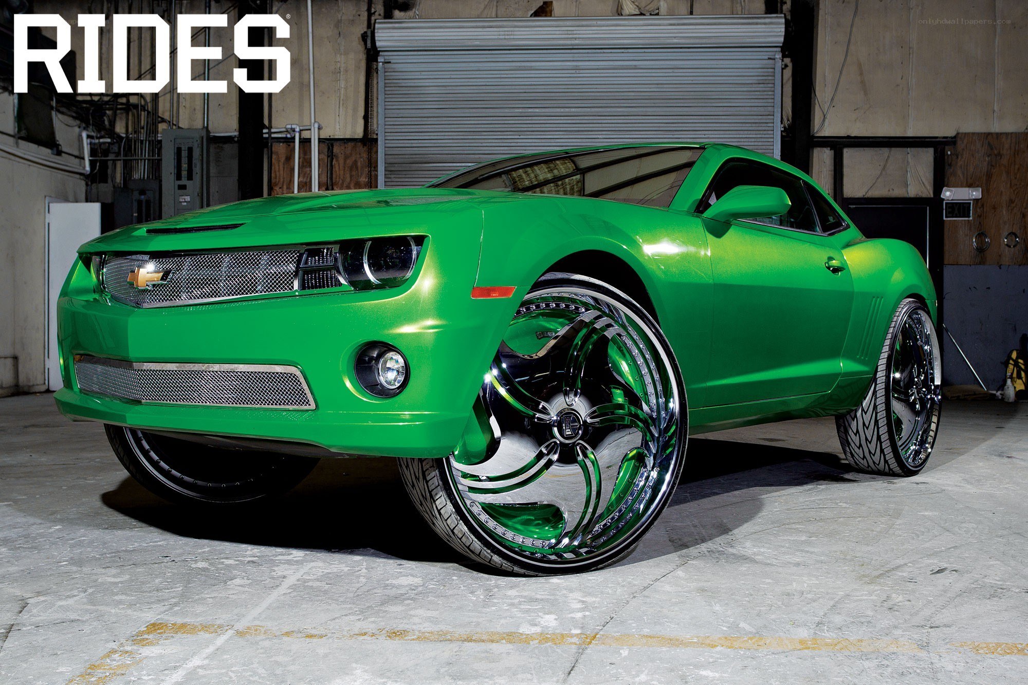 green camaro with custom wheels