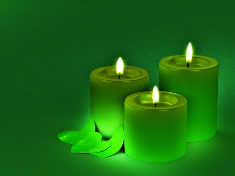 green candles with leaves