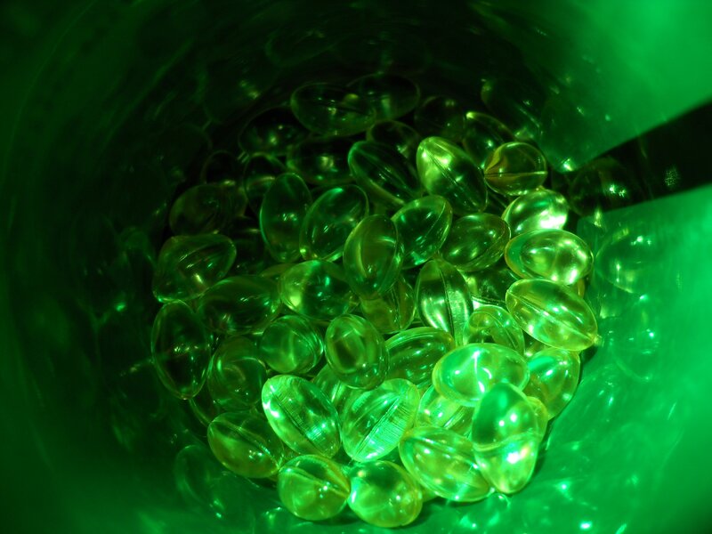 green capsules in a container