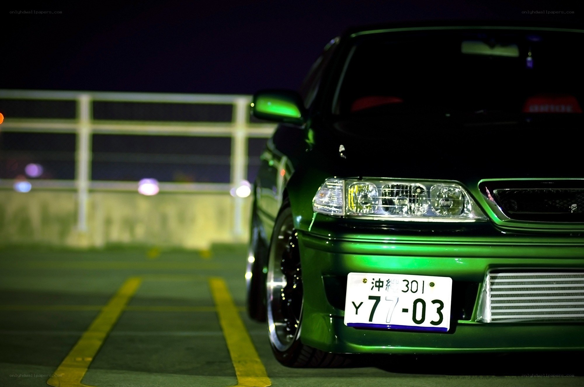 green car at night